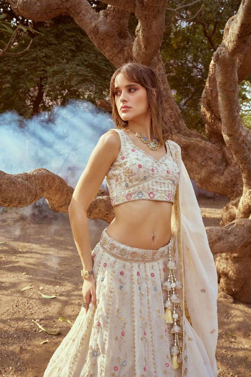 Moti hand work by cream gold crushed tissue fabric lehenga choli dupatta manufacturer surat 