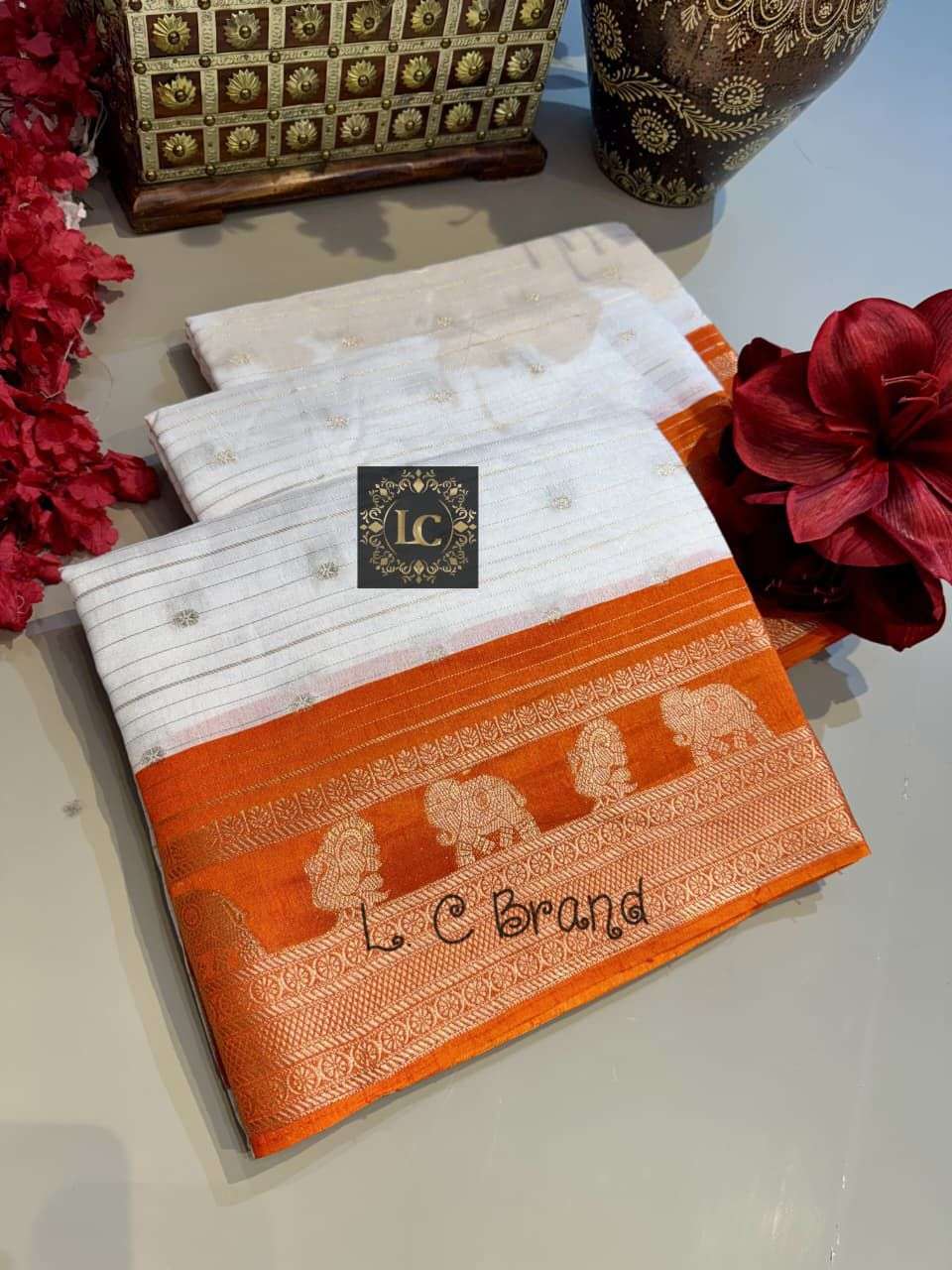 Semi Dola White–Orange Saree with Zari Lines & Rich Pallu